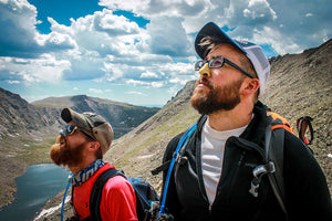 Two men using best spf for face sunblock on their noses